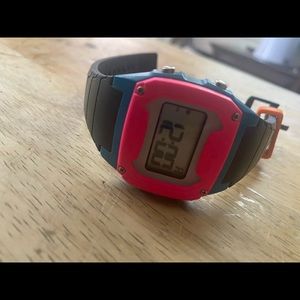 Freestyle digital watch. Black, pink, black orange